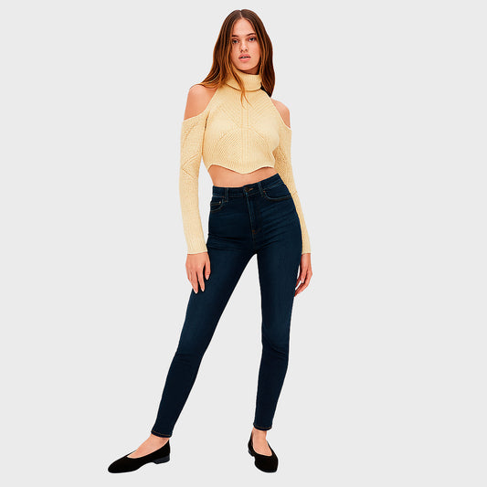 Short beige blouse with long sleeves and a high neck